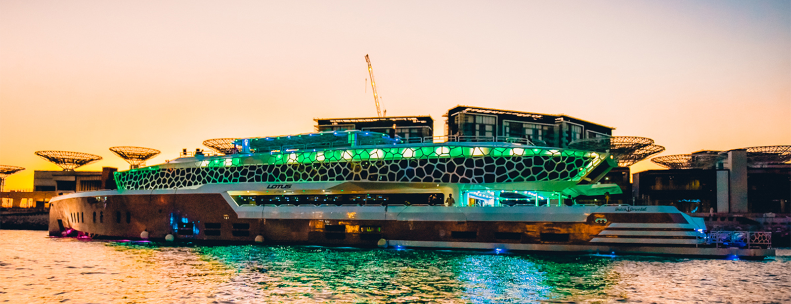 بلیط کشتی لوتوس دبی - A picture of the Dubai Lotus ship at sunset