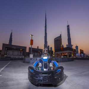 بلیط کارتینگ دبی مال - Karting in Dubai with Burj Khalifa behind