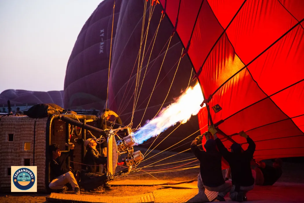 بلیط بالن هوایی دبی - Dubai hot air balloons being lit up